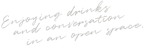 Enjoying drinks and conversation in an open space.